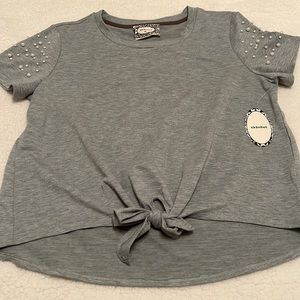 Gray shirt with faux pearl cap sleeve details.